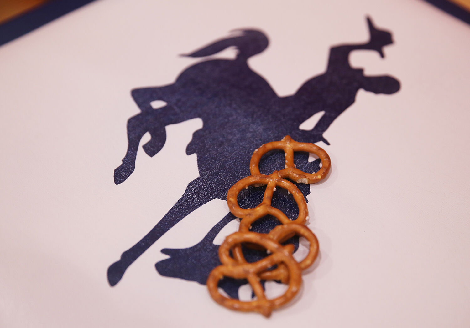 A handful of pretzels wait for the return of their owner on the Kaycee bench